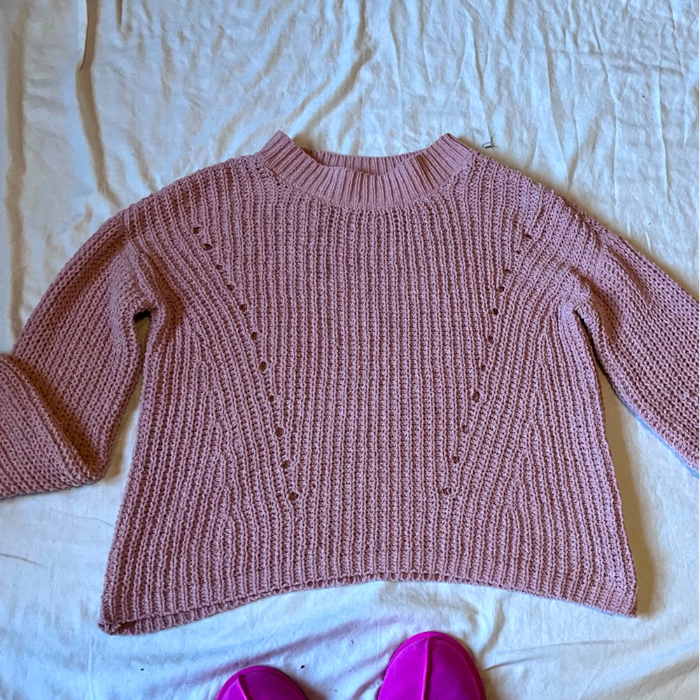 Soft pink knit sweater. Comfy and warm. Small tear on the back of the neckline.